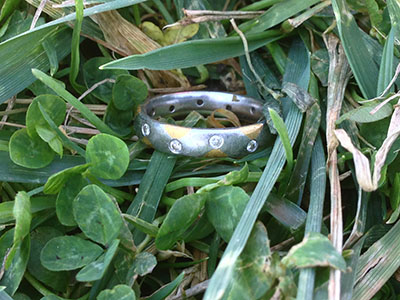 Kevin's gold and platinum wedding ring with small diamonds
