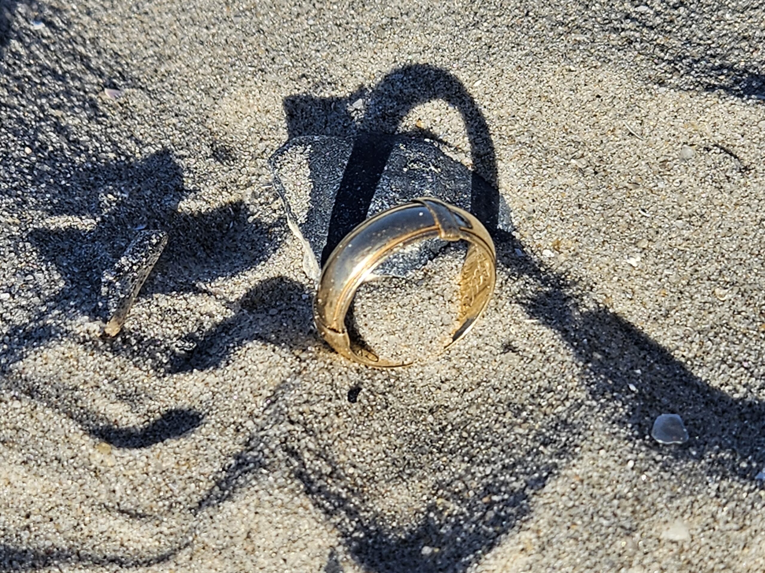 Find ring in sand 